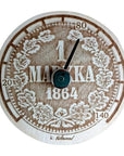 Löylymittari taustaan laserkaiverrettu kuva ensimmäisestä Suomessa painetusta hopeamarkasta vuodelta 1864.