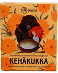 Solan Kehäkukka-saippua suloisessa keltaisessa pahvipakkaksessa, jota koristavat piirretyt oranssit kehäkukat sekä saippuapataa sekoittavat karhu ja punahiuksinen tyttö.